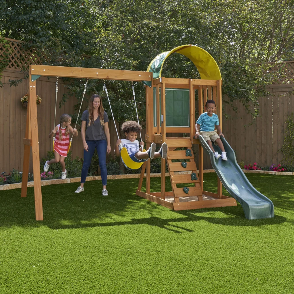 KidKraft Ainsley Wooden Outdoor Swing Set with Slide and Rock Wall — close-up detail of design and finish